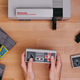 Image for article titled Wireless Adapter Lets You Use a PS4 Controller on Your Classic 8-Bit NES Console